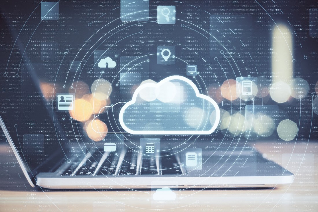 Cloud graphics superimposed over photograph of a laptop